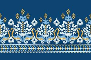 Ikat floral paisley embroidery on blue background.Ikat ethnic oriental pattern traditional.Aztec style abstract vector illustration.design for texture,fabric,clothing,wrapping,decoration,sarong,scarf.