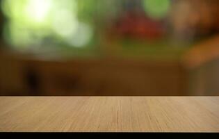 Empty wooden table in front of abstract blurred background of coffee shop . can be used for display or montage your products.Mock up for display of product photo