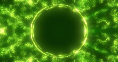 Abstract green background from an energy blue magic ring of a round frame of glowing particles and waves of energy photo