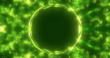 Abstract green background from an energy blue magic ring of a round frame of glowing particles and waves of energy photo