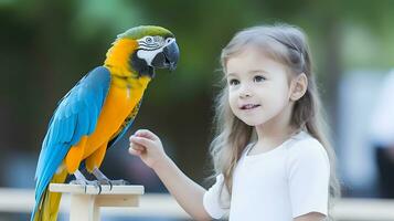 Macaw parrot and little girl. Pet bird concept. photo