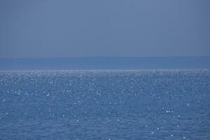 calm blue sea landscape with cloudless sky and water photo