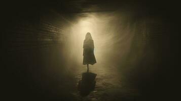 A vintage sepia grunge edited image shows a ghostly woman in a dress in a foggy tunnel at night. silhouette concept photo