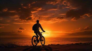 person on a bicycle in the sunset. silhouette concept photo