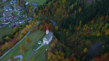 an aerial view of a church in the fall video