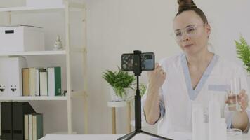 a cosmetologist is showing cosmetic product and function to the camera video