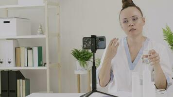 a cosmetologist is showing cosmetic product and function to the camera video