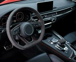 Car steering wheel and interior background, modern city car elements close view. Car inside interior photo