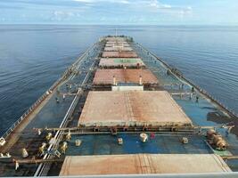 View from the bridge of the bulk carrier Capesize to the hold. Large ship in the ocean photo