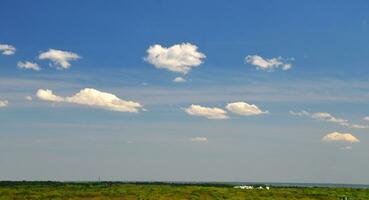 White clouds and green field wallpaper photo