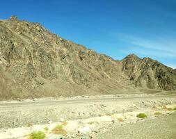 Road going through Sinai mountains, hills and desert photo