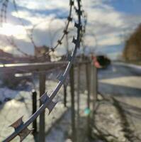 Barbed wire fence, prison and freedom conceptual background photo