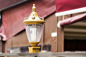 Vintage streetlight with yellow glass photo