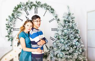 Christmas Couple.Happy Smiling Family at home celebrating.New Year People photo