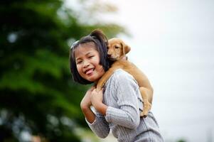 little girl and dog Love between man and dog Bonding of children and intelligent pets playing in the backyard love concept photo