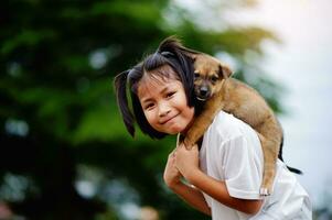 little girl and dog Love between man and dog Bonding of children and intelligent pets playing in the backyard love concept photo