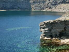 Cliffs and Atlantic ocean background, rocks and laguna, beauty in nature. Vacation trip wallpaper photo