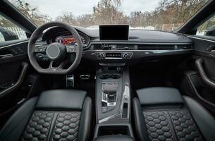 Inside moden car background, luxury car interior elements wallpaper. Black leather car interior photo