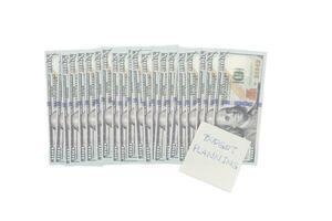 Money budget planning note with Dollars isolated on white background, financial goal concept. photo