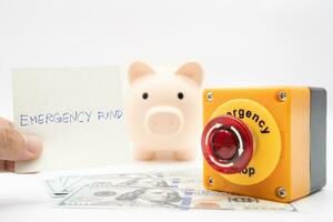 Concept of emergency savings fund. A piggy bank with dollar and stop button. money with piggy bank for saving emergency money. photo