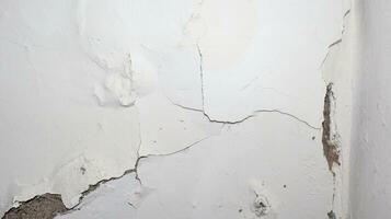 cracked concrete wall covered with gray cement photo