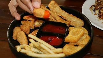 French fries, Nuggets and delicious fried otak otak served with Spicy Sauce photo