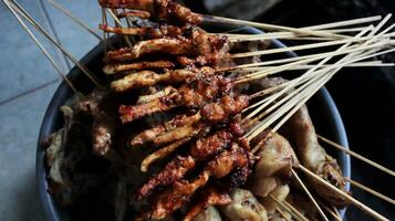 The process of burning satay on the burning coals photo