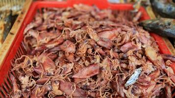 Various salted fish sell in a traditional market photo