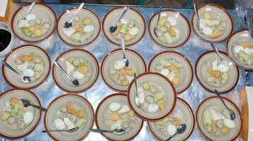 Close up of several bowls of Soto photo