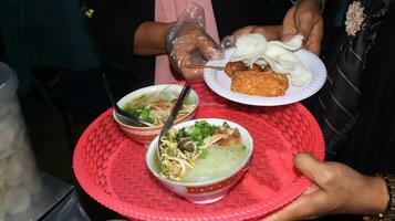 Close up of several bowls of Soto photo