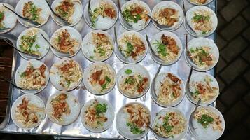 Close up of several bowls of Soto photo