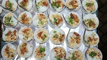 Close up of several bowls of Soto photo