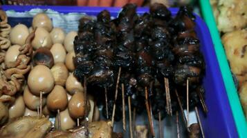 Angkringan is a wheelbarrow to sell various kinds of food and drinks on the roadside photo