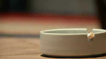 Closeup of empty ashtray with blurred background photo