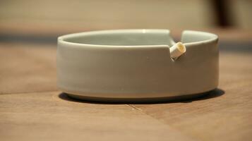 Closeup of empty ashtray with blurred background photo