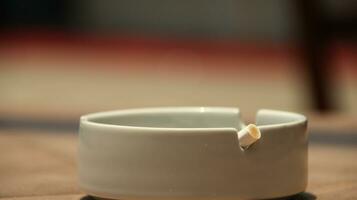 Closeup of empty ashtray with blurred background photo