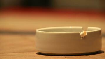 Closeup of empty ashtray with blurred background photo