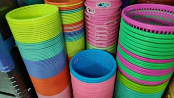 Cheap plastic household items for sale on the market close up photo