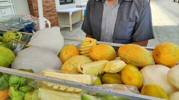 Fruit rujak cart by street vendors. Rujak fruit or traditional fruit salad from Indonesia photo