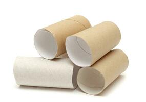 pile of empty rolls of toilet paper isolated on white baclground photo