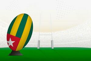 Togo national team rugby ball on rugby stadium and goal posts, preparing for a penalty or free kick. vector