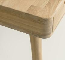 Wooden table corner and leg close view photo, wooden eco furniture elements background. Solid wood furniture leg photo