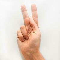 Letter K in American Sign Language ASL for deaf people photo