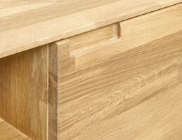 Wooden drawer with a handle close view photo, wooden furniture elements background. Furniture details photo