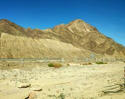 Road going through Sinai mountains, hills and desert photo