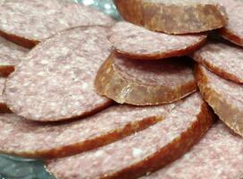 Sausage dish close view, sliced meat for dinner photo