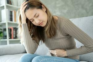 women hold flower symbol on menstrual, have abdominal pain, ache, menstrual cramps, colon cancer, belly inflammation problem, cervical cancer, ovarian cancer, abdomen, smell, vaginal discharge photo