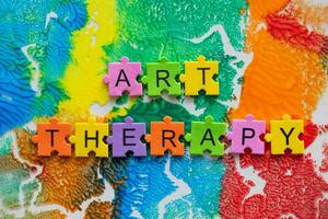 art therapy concept with colorful puzzle pieces on a colorful background photo