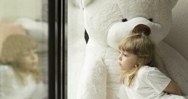 Little girl with teddy bear photo