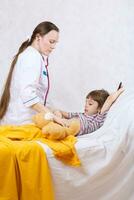 a woman is examining a child photo